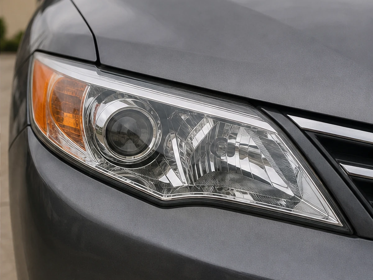 Illustrative sedan headlight with a clear restored finish